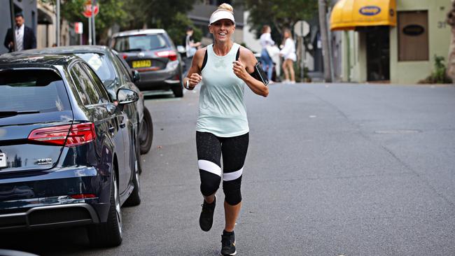 Kristi Miller runs into work at Holt St, Surry Hills. Photo: Adam Yip