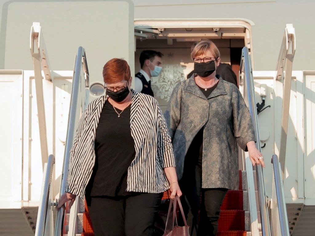 Marise Payne and Linda Reynolds arrive in Washington wearing face masks.