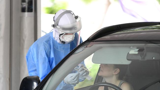 A woman is tested for Covid-19 at a drive-through clinic at in Brisbane. Picture: NCA NewsWire / Dan Peled