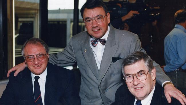 Norwood Football Club chairman Nerio Ferraro, left, benefactor Wolf Blass and Sturt Football Club chairman Neville Cunningham signing the final documents for the Norwood-Sturt bid for SA's second AFL licence in September 1994.