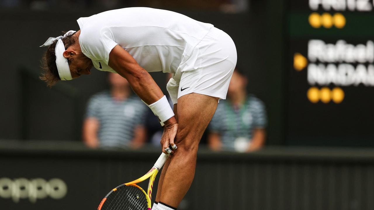 Rafael Nadal feels the effects of debilitating injury in the Wimbledon quarter-final against Taylor Fritz. Picture: AFP