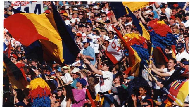 Adelaide Crows fans cheering on their team at Football Park during the 1993 season. Picture: RAY TITUS