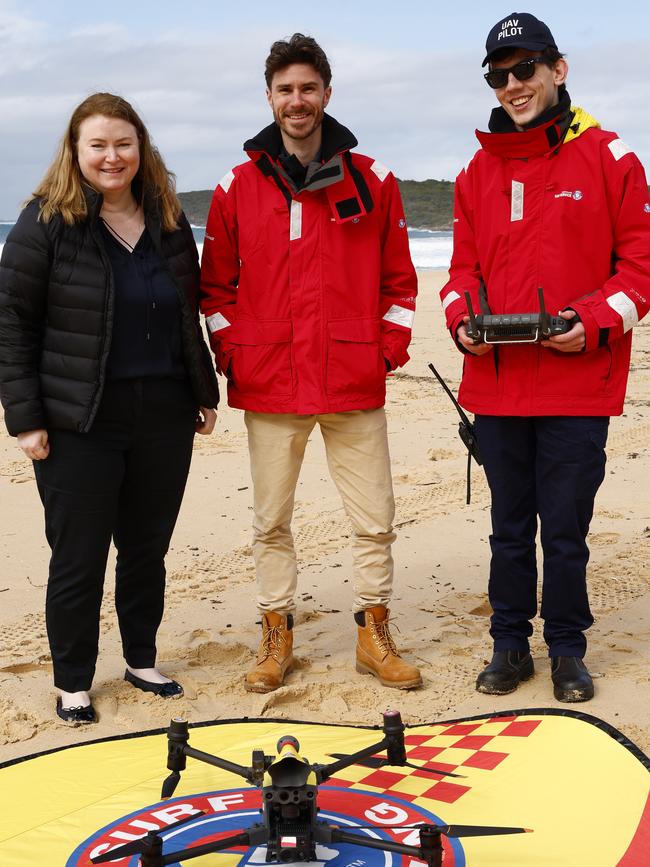 Minister for Agriculture Tara Moriarty with Surf lifesaving UAV pilots James Bassam and Lachlan Smith (right) with a drone used over shark nets to check for trapped wildlife at Maroubra Beach. Picture: Jonathan Ng