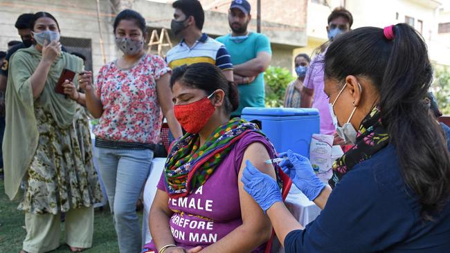 A woman gets inoculated with a dose of Covaxin vaccine against the Covid-19 coronavirus at a vaccination camp in Amritsar on Saturday. Picture: AFP