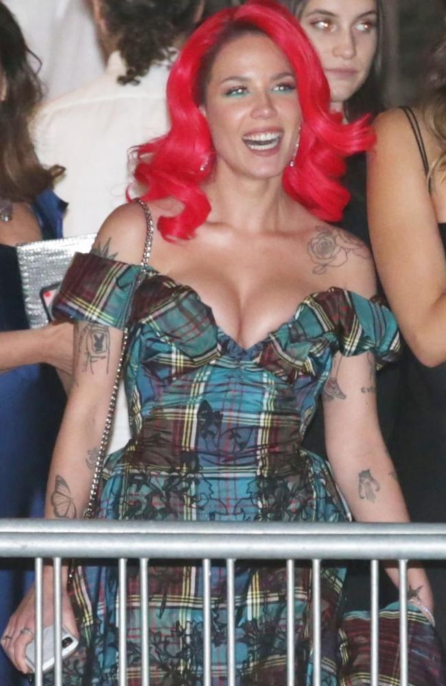 Halsey dons vibrant red hair as she puts on an impressive display of cleavage at the 2019 Vanity Fair Oscar Party. Picture: BackGrid 