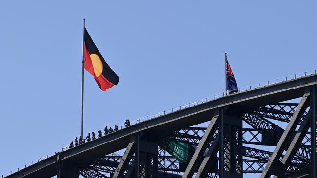 The Aboriginal Flag flying in its correct orientation over the Sydney Harbour Bridge. Picture: Jeremy Piper