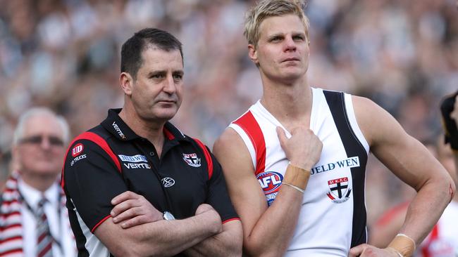 St Kilda coach Ross Lyon and captain Nick Riewoldt watch Collingwood receive the Premiers Cup after losing the AFL Grand Final Replay in 2010. Picture: Michael Klein