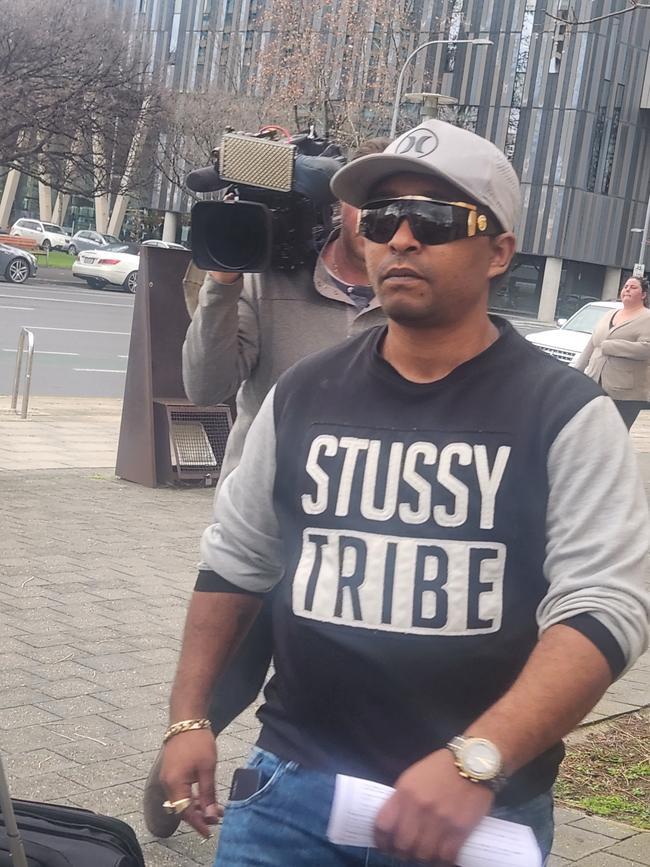 Solomon Woreta leaving the Adelaide Magistrates Court after pleading not guilty to robbery. Photo: Lucy Rutherford