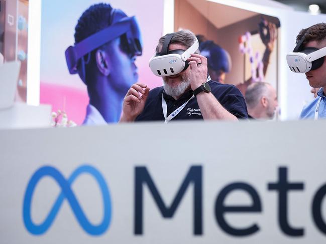 Visitors test Meta Quest 3 goggles at the Hanover technology fair in Germany last month. Picture: AFP