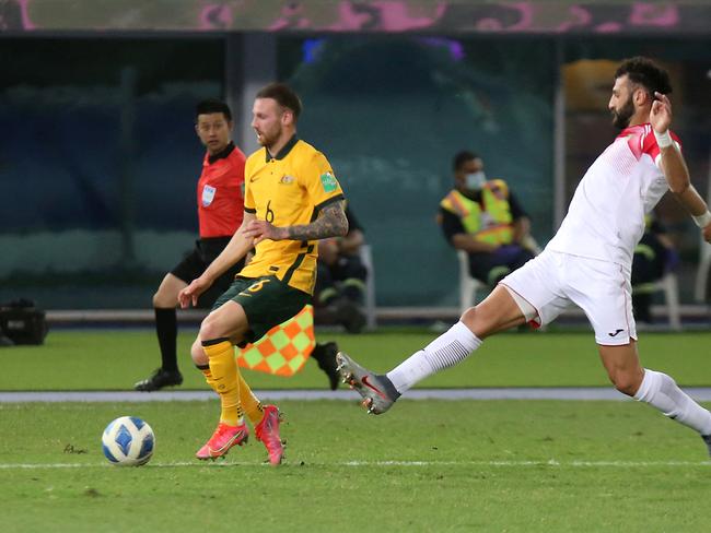 Martin Boyle (left) controls the ball during the Socceroos clash with Jordan. Picture: Yasser Al-Zayyat / AFP