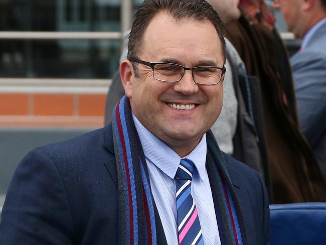 Trainer Robbie Griffiths is all smiles after Zarpoya won race 4, Keno Kwikpik Handicap during Caulfield Race Day at Caulfield Racecourse in Melbourne, Saturday, June 30, 2018. (AAP Image/George Salpigtidis) NO ARCHIVING, EDITORIAL USE ONLY