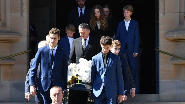 Carla Zampatti’s family carry her casket from St Mary's Cathedral following her State Funeral oPicture: Getty Images.