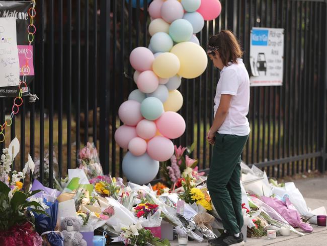 Flowers left today at the school’s front gate where the two boys died. Picture: John Grainger