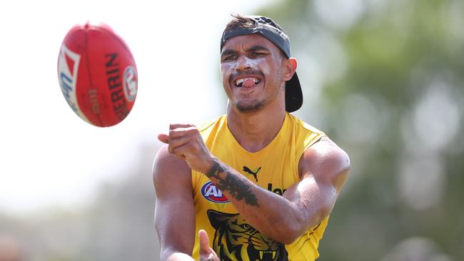 GOLD COAST, AUSTRALIA - JANUARY 30: Sydney Stack handballs during a Richmond Tigers AFL training session at Southport Sharks on January 30, 2020 in Gold Coast, Australia. (Photo by Chris Hyde/Getty Images)