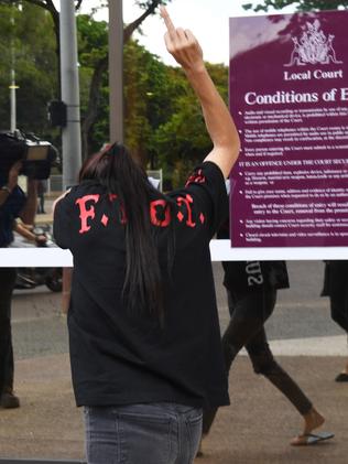 An alleged bikie associate leaves Darwin Local Court.