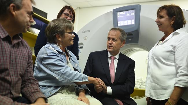 Bill Shorten speaks to cancer patient Sandy Eglin during a visit to Derby Street Medical Centre. Image: Lukas Coch