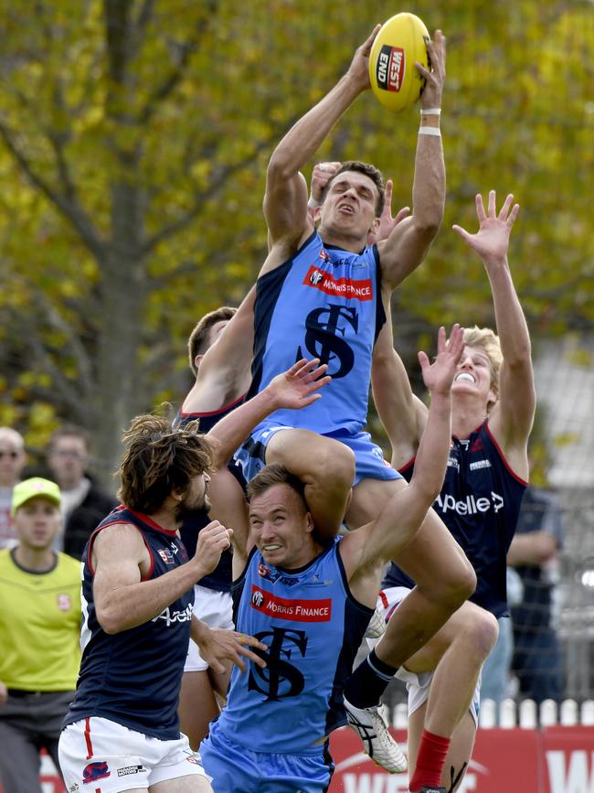 Ash Johnson showcasing his trademark spring ith this spectacular mark. Picture: Naomi Jellicoe