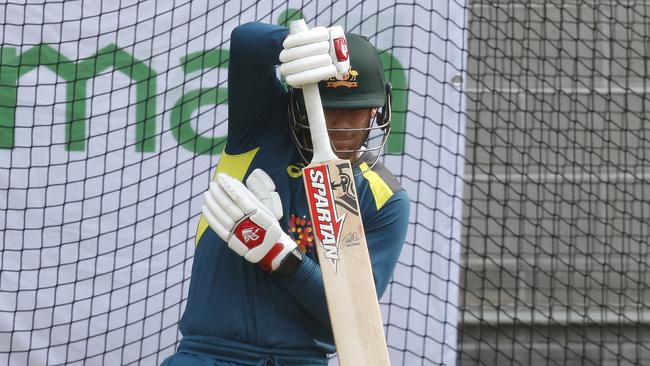 David Warner removes his left hand from the bat after being struck. Picture: Darrian Traynor/Getty