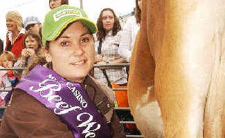 Beef royalty: 2009 Beef Week Queen Kassandra Whitney takes part in the milking competition at the Casino Beef Week Breakfast With the Butchers morning.