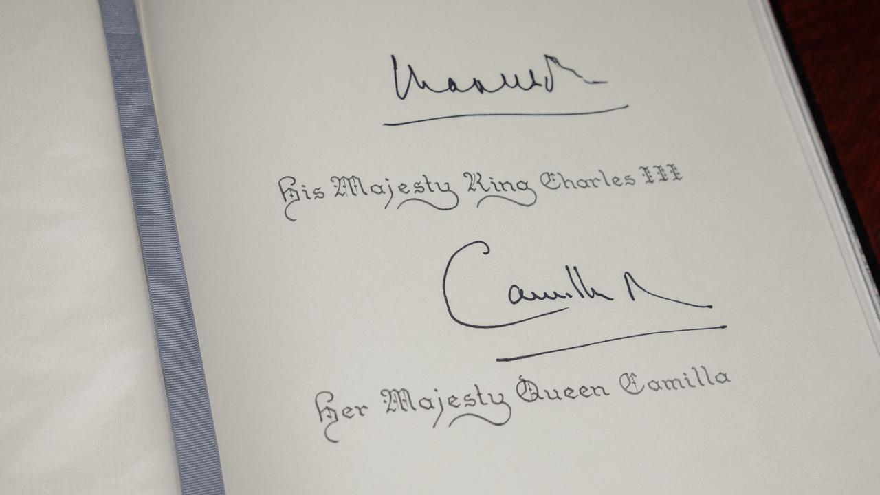 The visitor's book bearing the signatures of Britain's King Charles III and Queen Camilla after they signed it at the Australian War Memorial in Canberra on October 21. Picture: Brook Mitchell/POOL/AFP