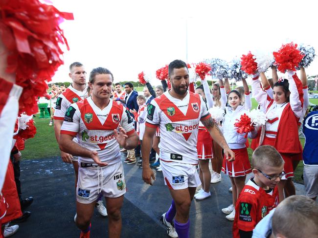 Benji Marshall and Mitch Rein head down the guard of honour after their final game for the Dragons last year. Picture: Mark Evans