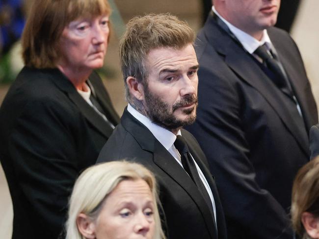 Former football player David Beckham (C) leaves the church after the funeral service  for late Swedish football manager Sven-Goran Eriksson at Fryksande church in Torsby, Sweden, on September 13, 2024. Swedish football manager Sven-Goran Eriksson, who coached England from 2001 to 2006, died on August 26, 2024 at the age of 76 after a battle with pancreatic cancer, his agent said. (Photo by Adam Ihse/TT / various sources / AFP) / Sweden OUT