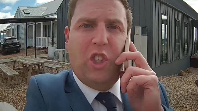 Ray White real estate agent Aaron Hill was seen on CCTV removing items from the property.