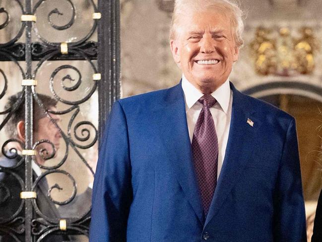 This handout picture released by the Palazzo Chigi press office on January 5, 2025 shows Italy's Prime Minister Giorgia Meloni posing with US President-elect Donald Trump at his Mar-A-Lago Club on January 4, 2025 in Palm Beach, Florida. (Photo by Filippo ATTILI / Palazzo Chigi press office / AFP) / RESTRICTED TO EDITORIAL USE - MANDATORY CREDIT "AFP PHOTO /PALAZZO CHIGI PRESS OFFICE" - NO MARKETING NO ADVERTISING CAMPAIGNS - DISTRIBUTED AS A SERVICE TO CLIENTS