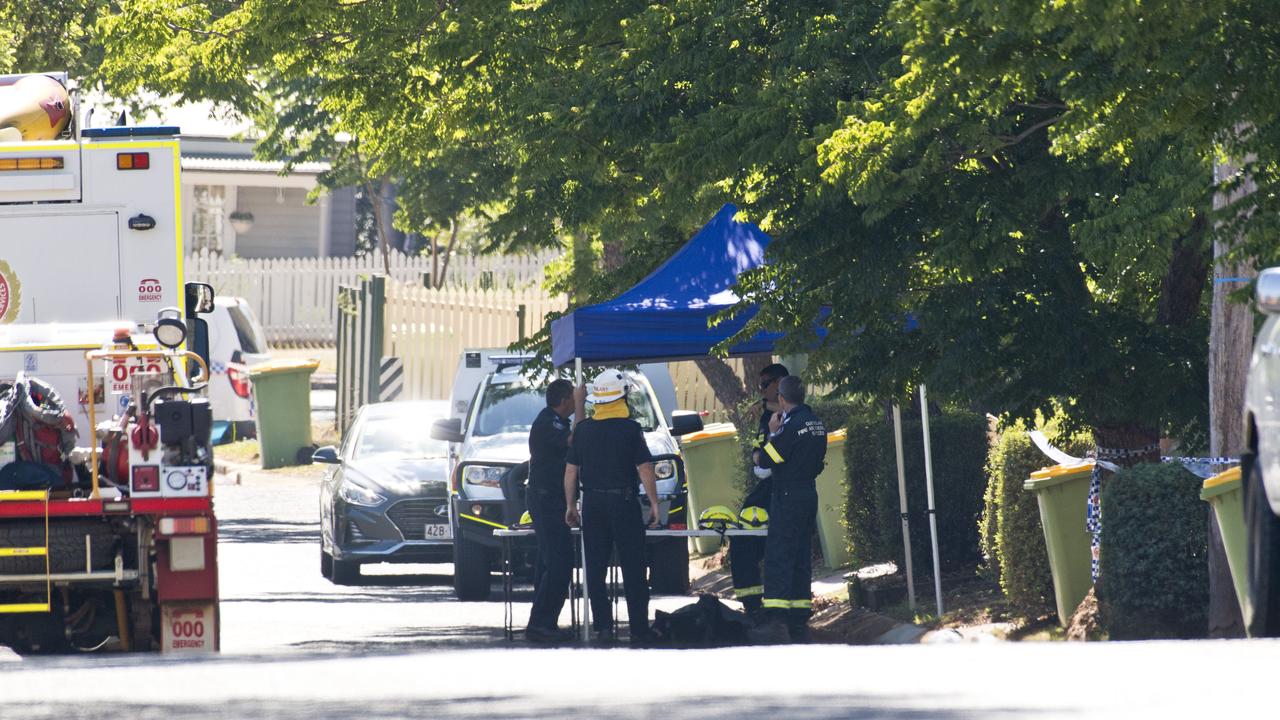 Police and fire investigators at the South Toowoomba crime scene. Picture: Kevin Farmer