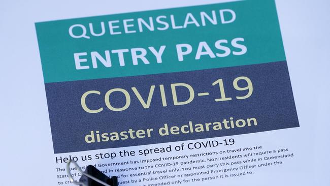 A Queensland Entry Pass which is being given out to eligible motorists stopped at a checkpoint on the Gold Coast Highway at Coolangatta on the Queensland/NSW border. (AAP Image/Dave Hunt)