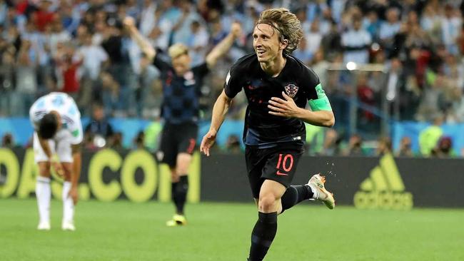 Why neutral fans should cheer for Croatia not France. Croatia's captain Luka Modric celebrates making Sunday's final.