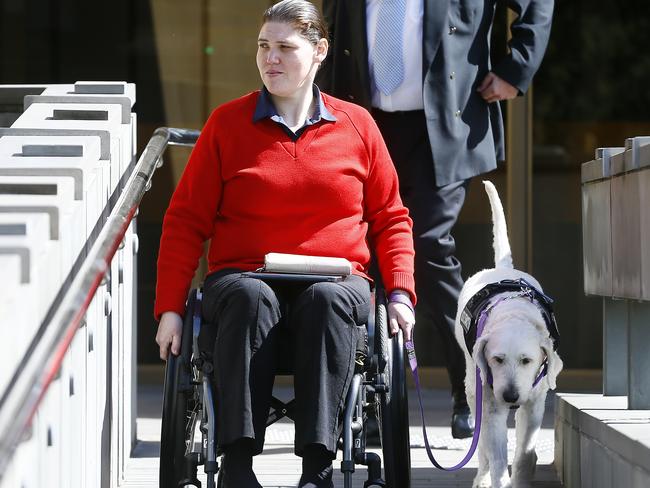 Arlene Maree Taylor leaves the Supreme Court with her assistance dog. Picture: MATT THOMPSON