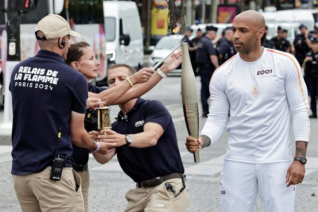 Former Arsenal and France footballer Thierry Henry, the coach of the male French Olympic team, was the first torchbearer