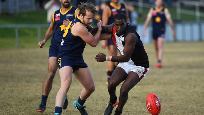 Abdi Fitaax (Right) of West Coburg battles for possession. Picture: James Ross.