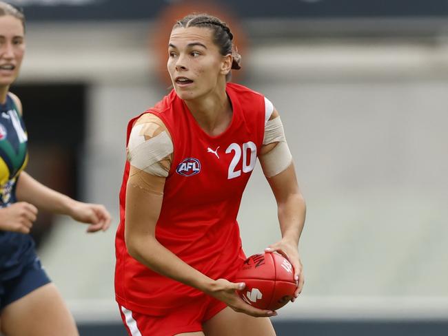 MELBOURNE, AUSTRALIA - APRIL 06:  Tunisha Kikoak of the U23 All-Stars runs with the ball during the Marsh AFL National Academy Girls vs U23 All-Stars at Ikon Park on April 06, 2024 in Melbourne, Australia. (Photo by Darrian Traynor/AFL Photos/via Getty Images)