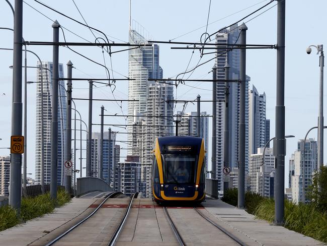 A G:link tram crosses the Sundale bridge from Southport to Surfers Paradise early in the morning. Picture: JERAD WILLIAMS