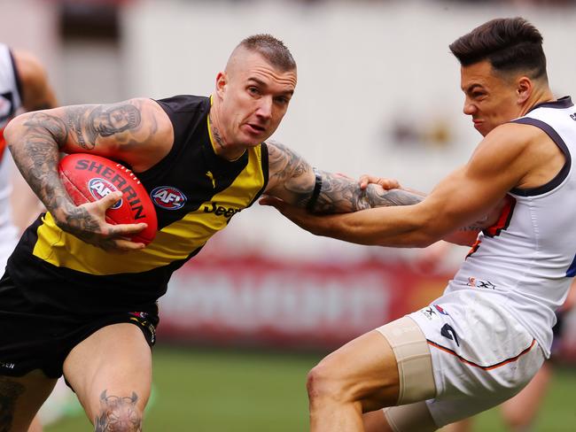 Dylan Shiel cops the full force of this stiff-arm.