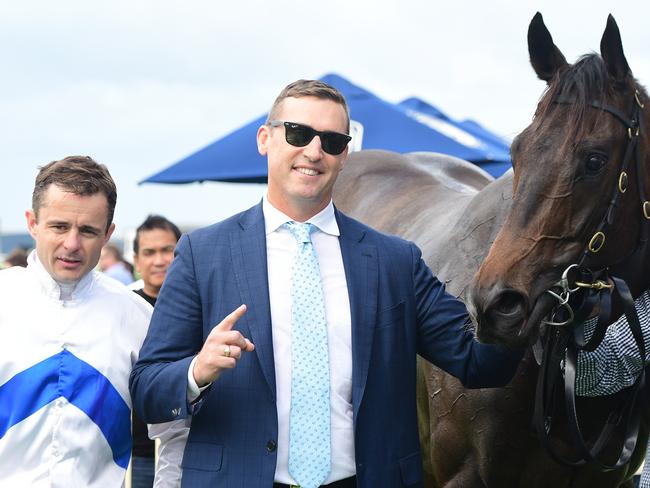 Dominant: Jockey Brad Stewart, trainer Tony Gollan and Zoustyle after his win at Doomben. Picture: Trackside Photography