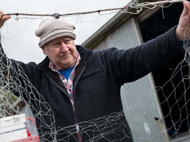 Fisherman Bob Gillam with a net destroyed by seals. Picture: Grant Wells