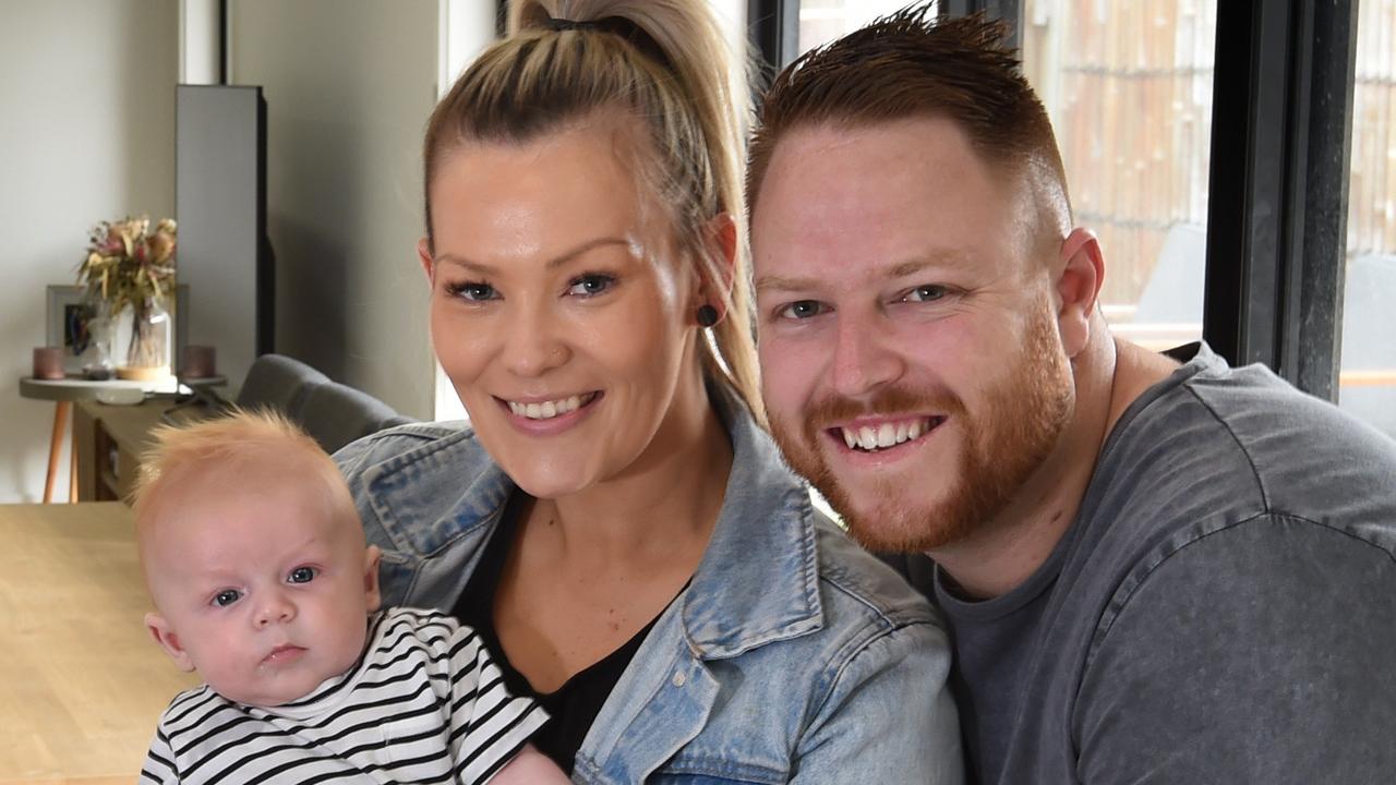 Dylan McGibbin, 29, wife Hayley, 28 and 11-week-old son Jett are focused on building up a rainy day savings account. They recently refinanced their home loan to save money too. Picture: Tony Gough