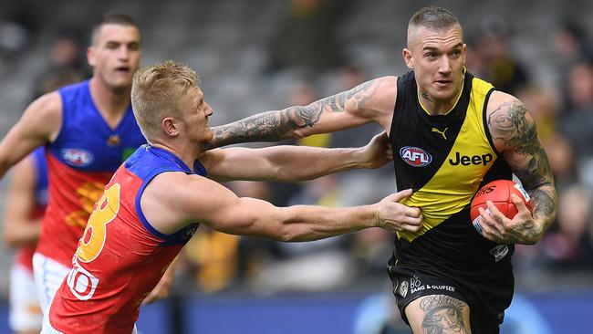 Dustin Martin received close attention from Lion Nick Robertson in Round 17.