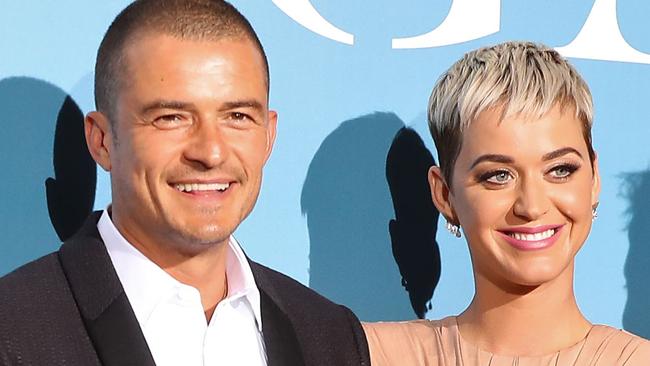 British actor Orlando Bloom (L) and US singer Katy Perry pose upon their arrival at the 2nd Monte-Carlo Gala for the Global Ocean 2018 held in Monaco on September 26, 2018. - On September 26, 2018, the Prince Albert II of Monaco Foundation will hold its second Monte-Carlo Gala for the Global Ocean, a major fundraising event in the heart of Monte Carlo, in order to support its worldwide initiatives in favor of a sustainable ocean, a crucial issue calling for immediate and collective action. (Photo by Valery HACHE / AFP)