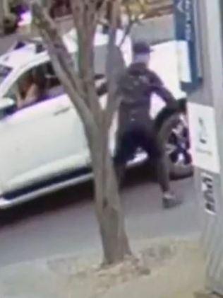 A man exits a ute and jogs towards the Range Rover. Picture: Channel 9