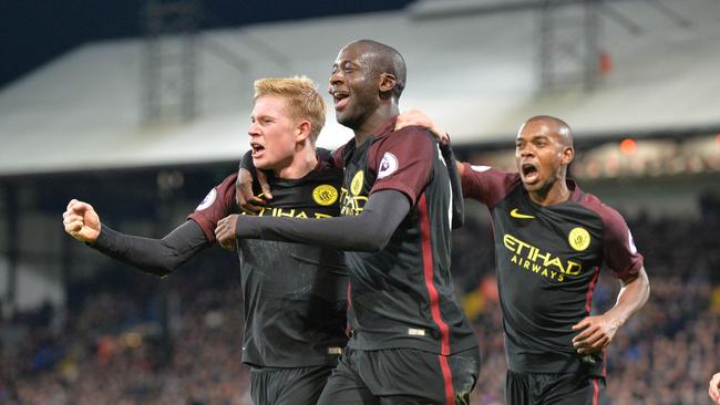 Yaya Toure (C) celebrates with Manchester City's Kevin De Bruyne (L).