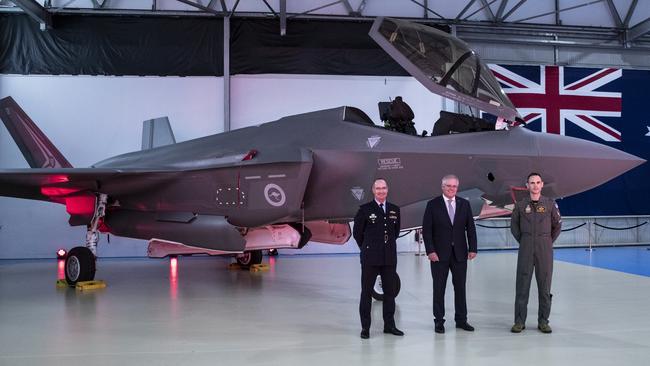 Chief of Air Force, Air Marshal Mel Hupfeld, then prime minister Scott Morrison and Commanding Officer, 2 Operational Conversion Unit, Wing Commander Jordon Sander with an F-35A aircraft while on a visit to BAE Systems Australia’s in Williamtown, NSW.