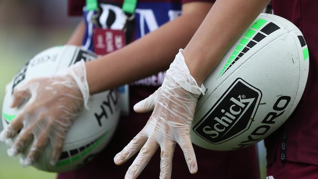 Ball boys wore gloves at Lottoland. Picture: Brett Costello