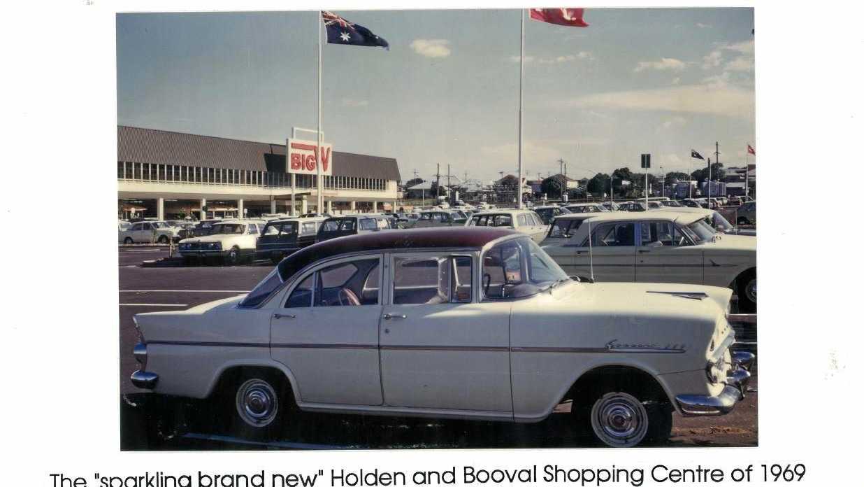 A classic Holden car parked outside the Woolworths Family Centre, now known as Booval Fair, in 1969. Picture: Contributed