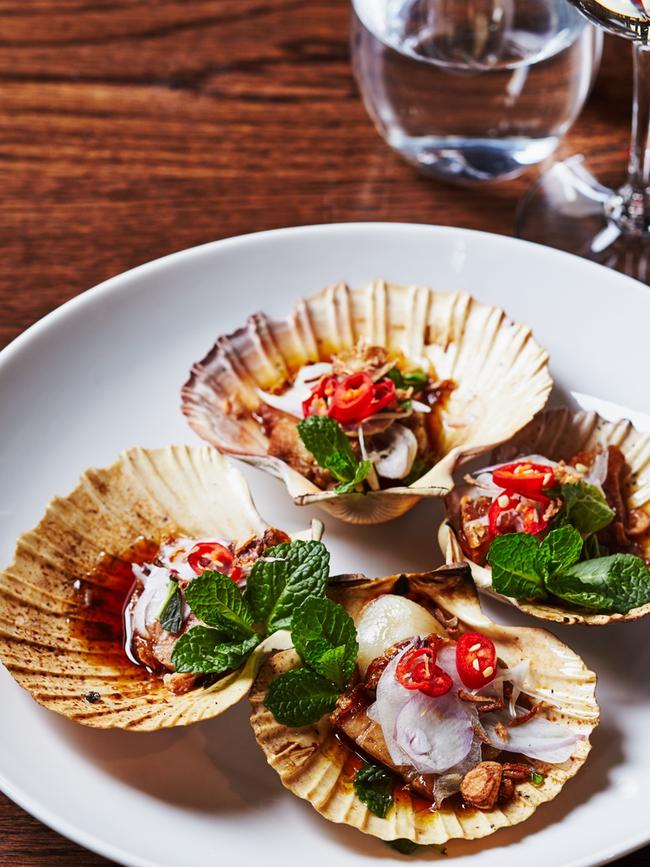 Seared Scallops with roasted pork belly, tamarind and palm sugar dressing, spearmint. Picture: Marina Oliphant