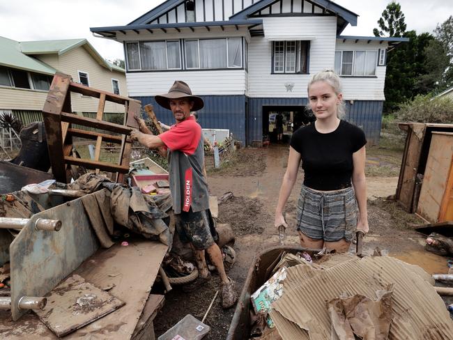 South Lismore resident Andrew Rose cleaning up with his daughter Gemma. Picture: Toby Zerna