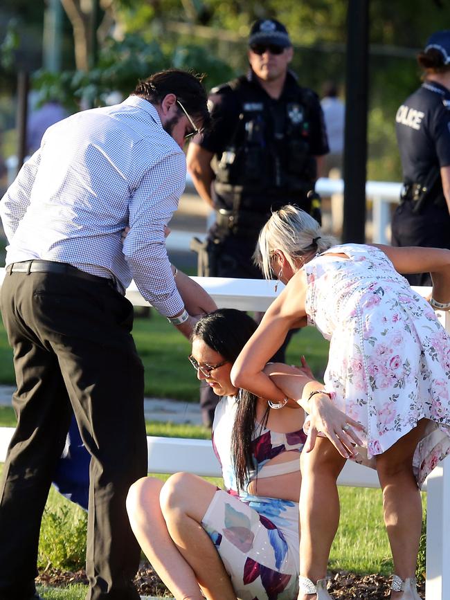 People leaving the Melbourne Cup Day at Eagle Farm. Picture: AAP/Richard Gosling